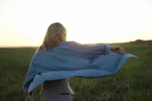 girl with shirt blowing in the breeze