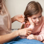 young girl with ear infection