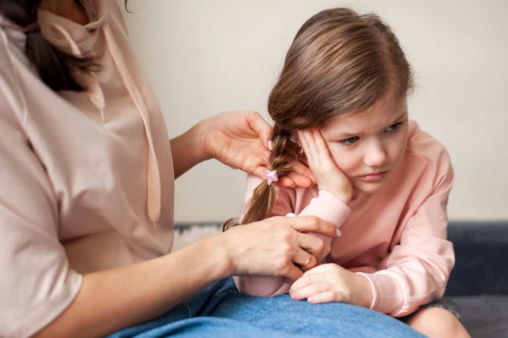 young girl with ear infection